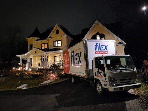 flex truck in front of house